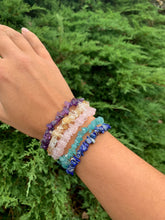 Load image into Gallery viewer, Classic crystal chip bracelet design with a natural crystal chip bead on a white elastic. Amethyst, Quartz, Green Aventurine, Onyx, Rose Quartz. Shop now!!